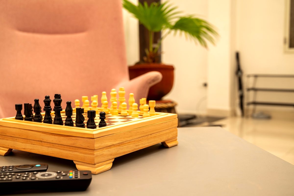 A chess set laid out on the table in the Premium room