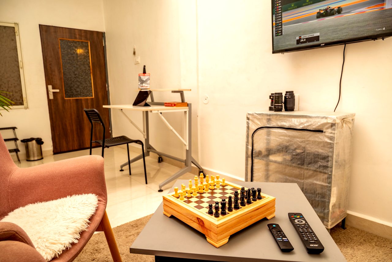 Premium room overview with desk, TV and doorway